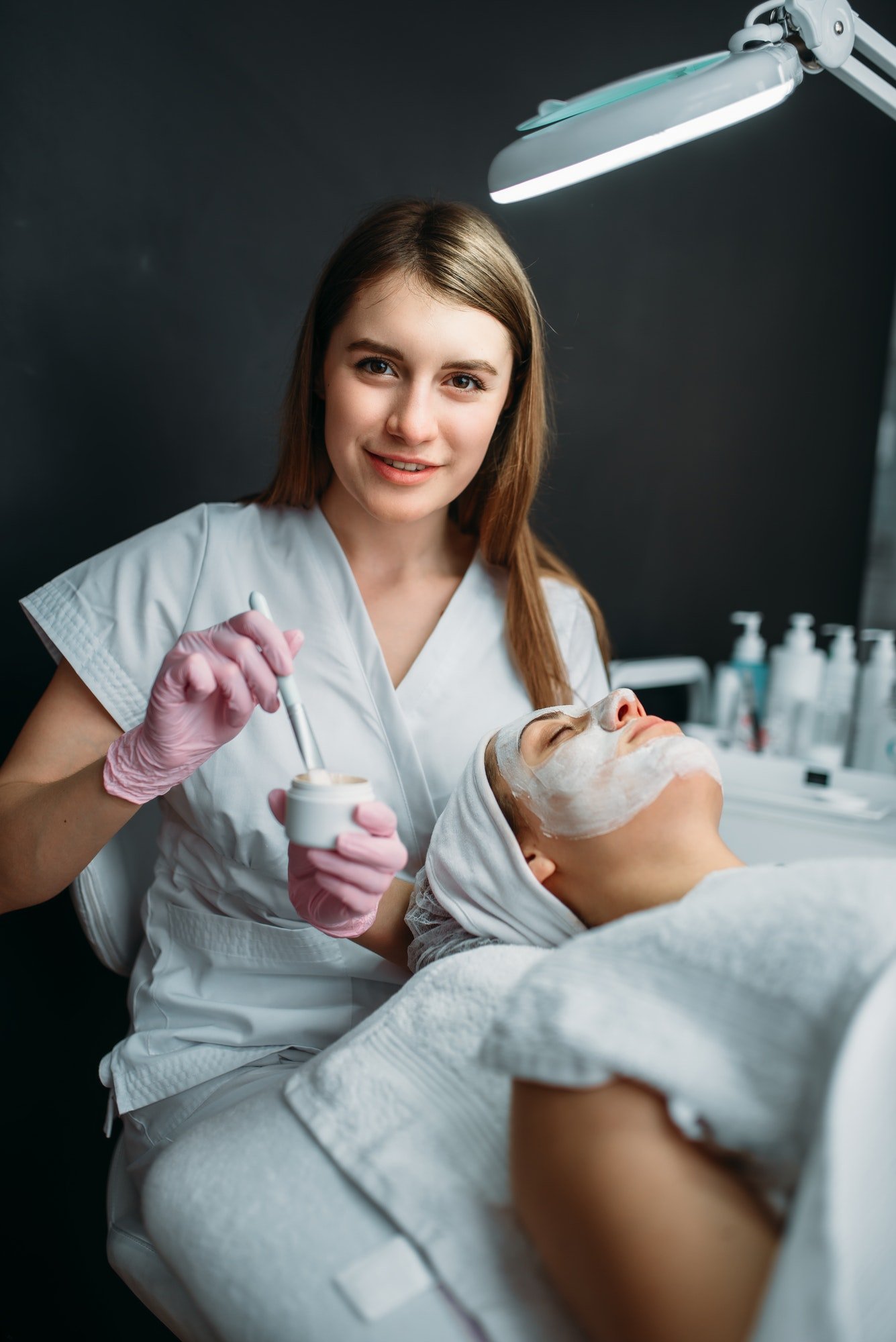 female-doctor-holds-cream-and-brush-in-hands.jpg